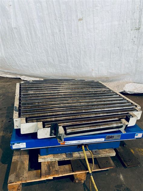 lb     sebastian hydraulic lift table  manual rotation conveyor stock