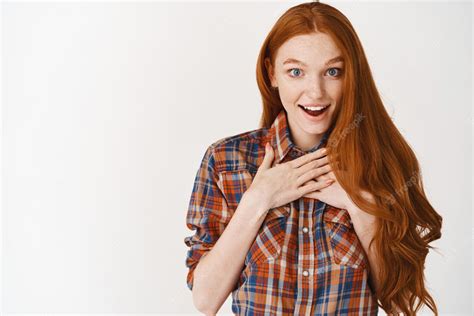 premium photo surprised redhead girl receiving a t looking