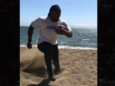 Marshawn Lynch Intense Beach Training With Footwork Expert Pounding
