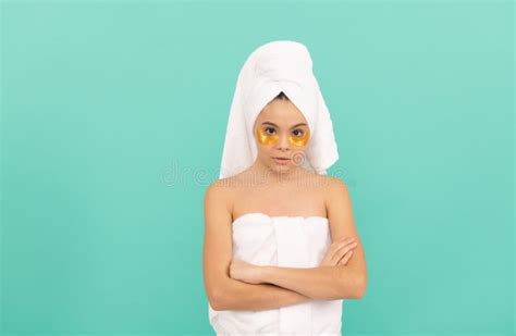 teen girl in shower towel with golden patch beauty and spa stock image