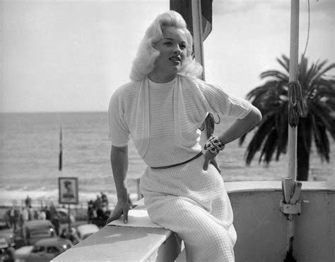 british actor diana dors 1931 1984 sits on an outdoor balcony