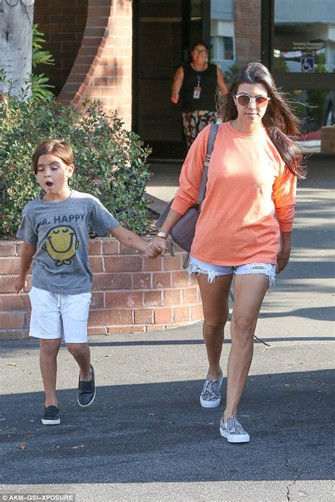 Kourtney Kardashian Flashes Her Toned Legs In Cut Off Shorts With Mr