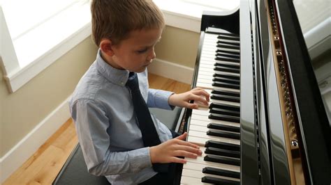 charming child performs piano  home stock footage sbv  storyblocks