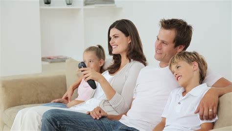 footage  high definition  family watching television  living room stock footage video