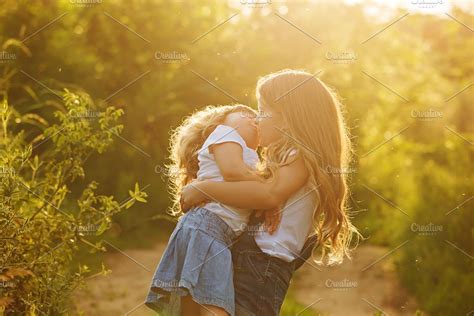 Two Cute Little Sisters Kiss High Quality People Images ~ Creative