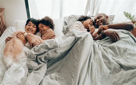 happy family  bed  stock photo