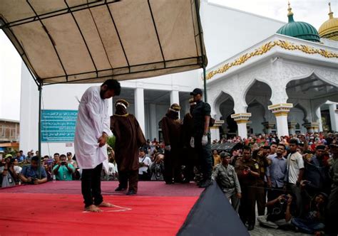 two men publicly caned in indonesia for having gay sex coconuts jakarta