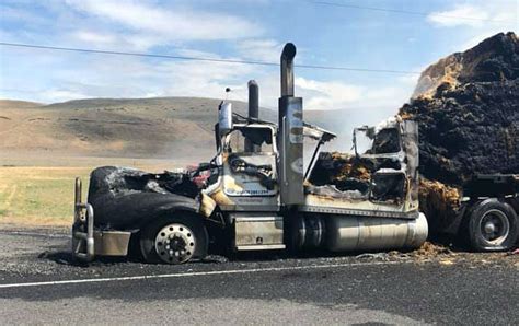 stunning   hay truck fire released driver escaped injury