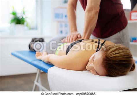 pleasant relaxed woman receiving a back massage such a pleasure