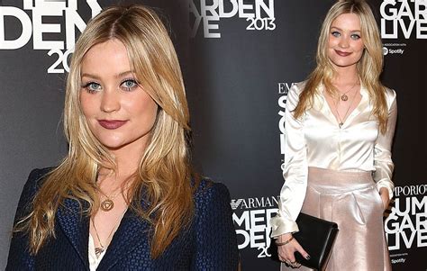 laura whitmore takes off navy coat to reveal cream blouse and metallic
