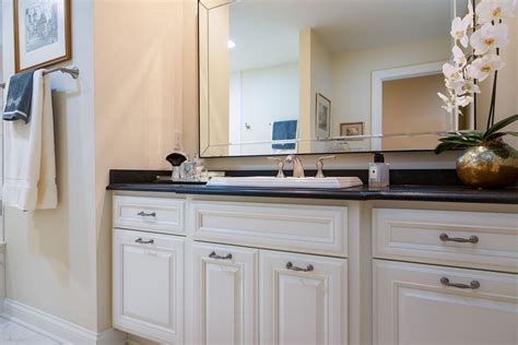 white cabinets  black granite countertops   bathroom nuwood