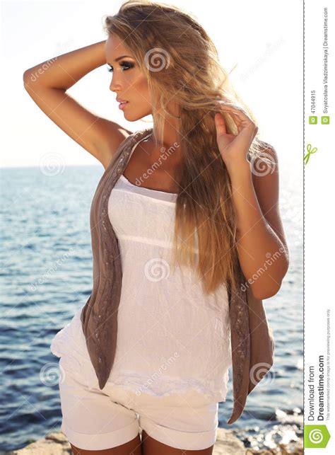 Girl With Luxurious Blond Hair Posing On Summer Beach