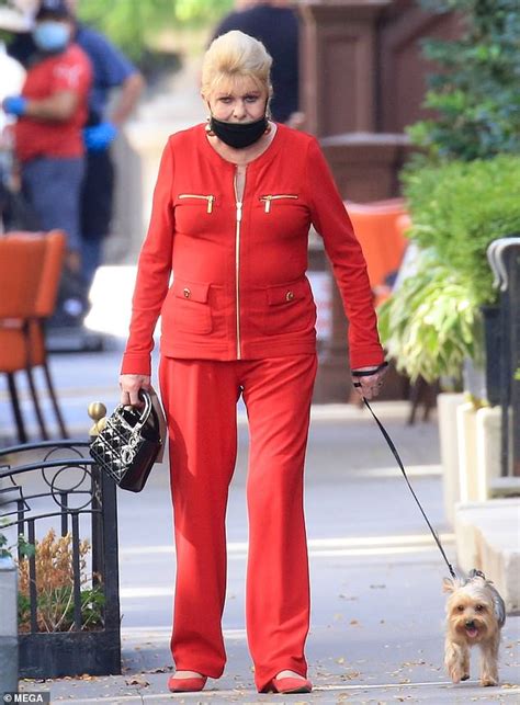 ivana trump models a bright red suit as she gets food from a new york
