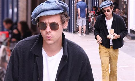 Harry Styles Gives A Nod To The 70s In Yellow Bell Bottom Flares And