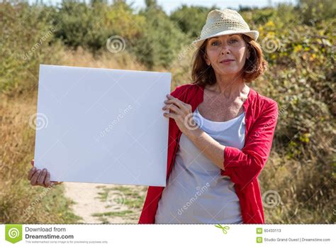 Gorgeous Mature Woman Smiling Showing Her Search On Sign