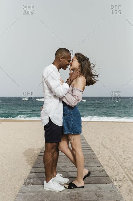 A Young Interracial Couple In Love At The Beach Stock Images Page
