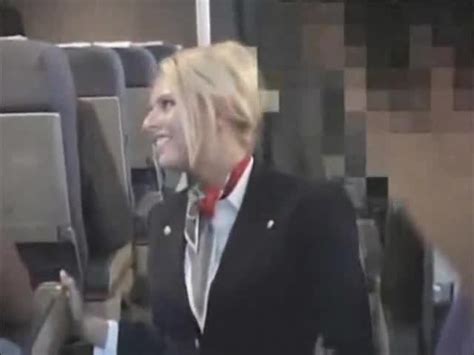stewardess gives a handy j on plane porn tube