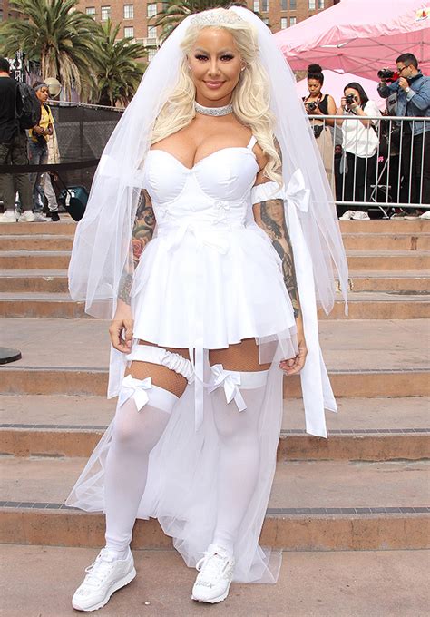 Amber Rose Stuns In Wedding Dress And Stockings At Her Annual Slutwalk