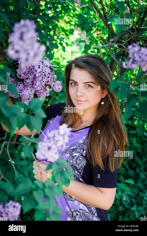 Portrait Of Beautiful Long Haired Dark Haired Girl In Purple Dress In