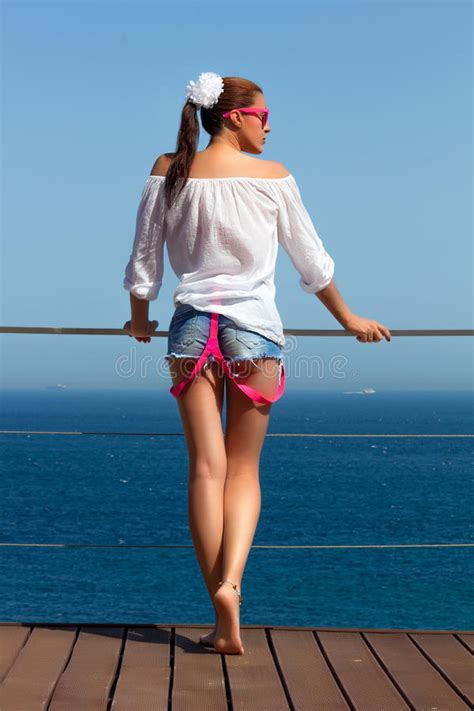 Backside Of Fashionable Girl In Denim Shorts Stock Image