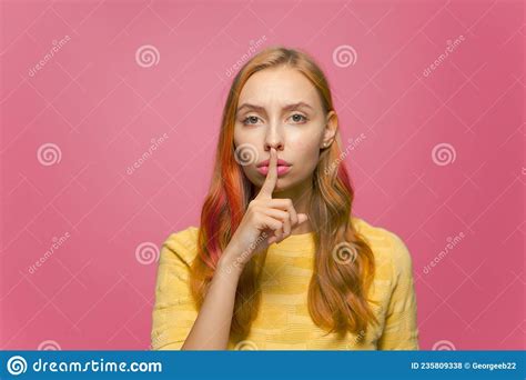 Beautiful Serious Young Girl Ask To Be Quiet And Keep Secret Showing