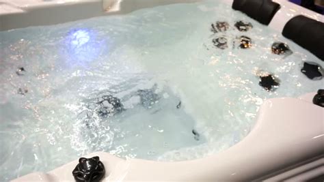 view of jacuzzi bathtub full of bubbling water stock
