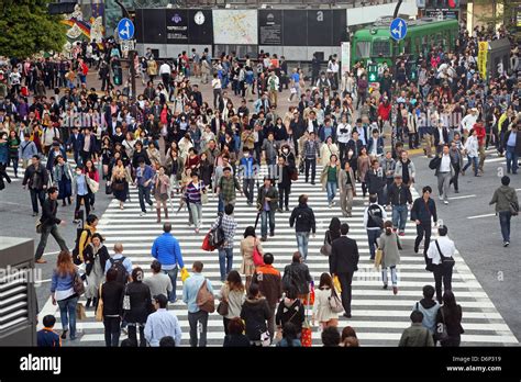 japanese street scene showing crowds  people crossing  street