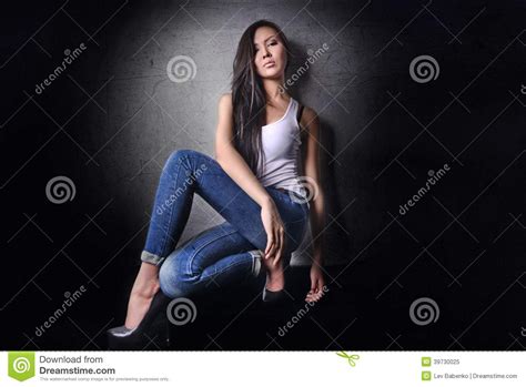 asian model in white t shirt and jeanse long hair and legs stock image