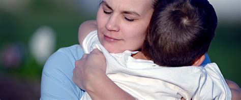 mom hugging child catholic social services alaska