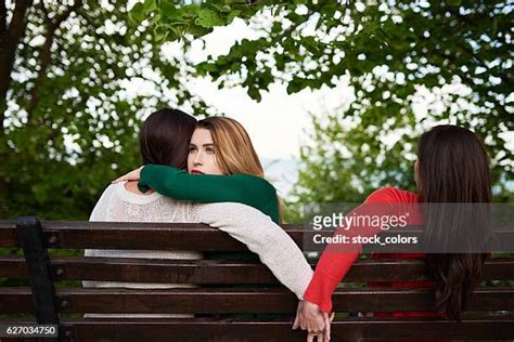 Romantic Lesbian Couple Sitting On Park Bench Photos And Premium High
