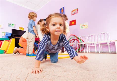 girl crawl  active class lesson  kindergarten stock photo image