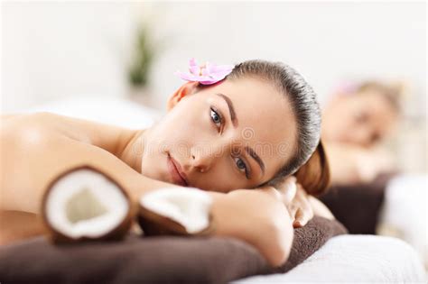 Two Beautiful Women Getting Massage In Spa Stock Image