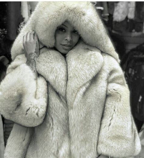 image may contain 1 person fur fur hood coat winter
