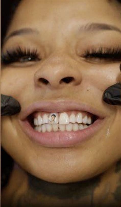 Watch Chrisean Rock Get Blueface Face Tattooed On Her Tooth