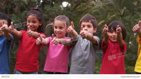 children raising  thumbs  smiling stock video footage