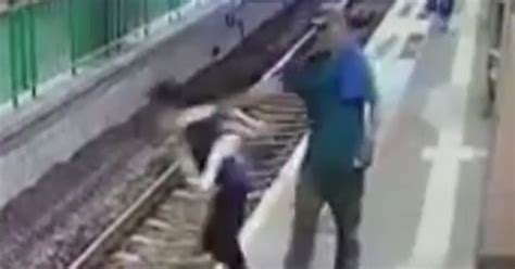 Chilling Moment Man Pushes Cleaner Onto Train Tracks At Station Then