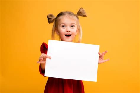 premium photo baby girl holding white sheet