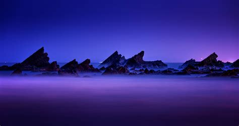 wallpaper purple sky sunset rocks beach seascape hd