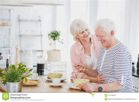 hugging couple in kitchen stock image image of coffee 113158225
