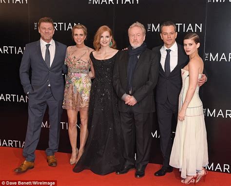 kate mara and kristen wiig ramp up the sex appeal at the martian premiere as they don flesh