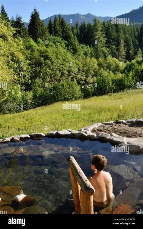woman soaking in hot spring outdoors at breitenbush hot springs