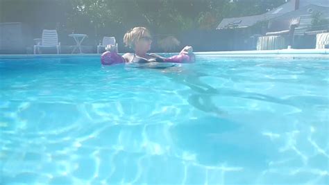 Underwater Video Of Young Pregnant Woman Swimming And Floating In A