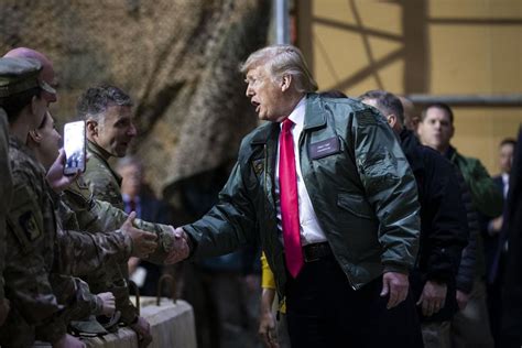 donald trump visits  troops  iraq    trip   conflict zone  star