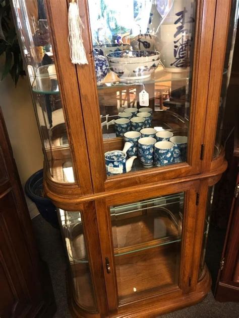 sold price light oak modern lighted curio cabinet wit mirrored  rounded glass sides
