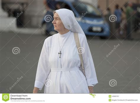 woman and spirituality catholic nun walking editorial photography