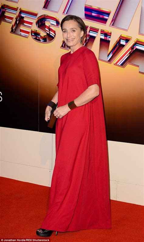 kristen scott thomas looks the picture of sophistication in floor length scarlet gown at bfi