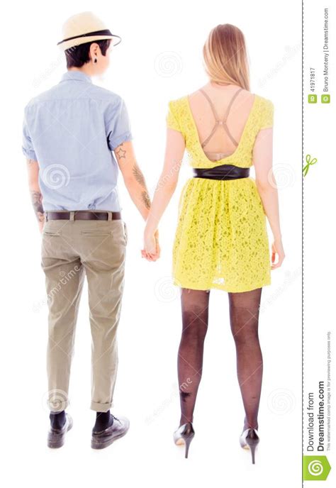 Rear View Of A Lesbian Couple Standing With Holding Hands