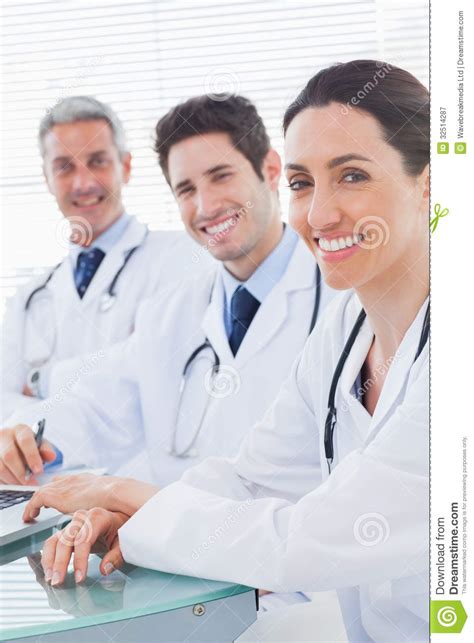 Smiling Doctors Looking At Camera Stock Image Image Of