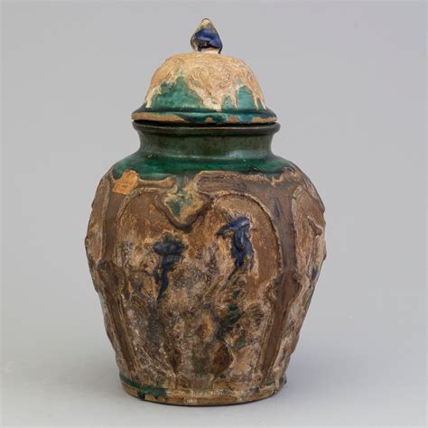 chinese shiwan ware pottery jar  cover qing dynasty  century bukowskis