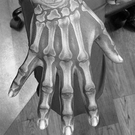 realistic looking colored hand tattoo of bone hand tattooimages